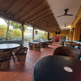 Covered indoor dining with a view of the stage for live music