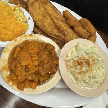 Stephanie's Restaurant - 2 piece fried flounder with Mac & cheese and potato salad. Added a side of yams - American Near Me - Greensboro, North Carolina Stephanie's Restaurant - 2 piece fried flounder with Mac & cheese and potato salad. Added a side of yams - American Near Me - Greensboro, North Carolina