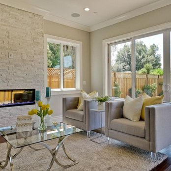 Olimpus Custom Homes - a living room with a fireplace - General Contractors Near Me - San Jose, California