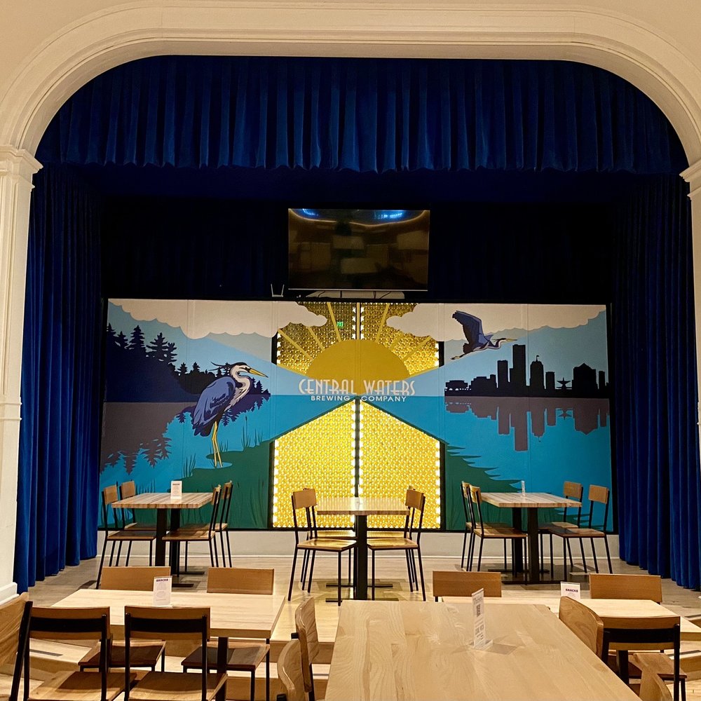 Central Waters Brewing Milwaukee - a stage with tables and chairs - Brewpubs Near Me - Milwaukee, Wisconsin Central Waters Brewing Milwaukee - a stage with tables and chairs - Brewpubs Near Me - Milwaukee, Wisconsin