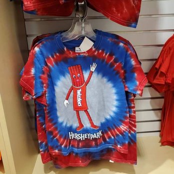Character Central - A children's tie-dye T-shirt with Hersheypark branding and Twizzlers character, in red, blue, and white colors. - Souvenir Shops Near Me - Hershey, Pennsylvania
