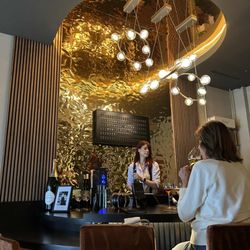 Winston Champagne Bar - Elegant circular bar and lighting