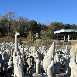 Deans Nursery - Large assortment of concrete lawn ornaments.