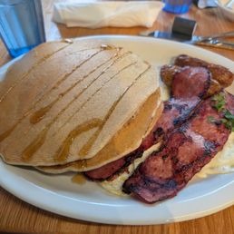 Protein pancakes with eggs, turkey, bacon and chicken sausage. It was delicious!.