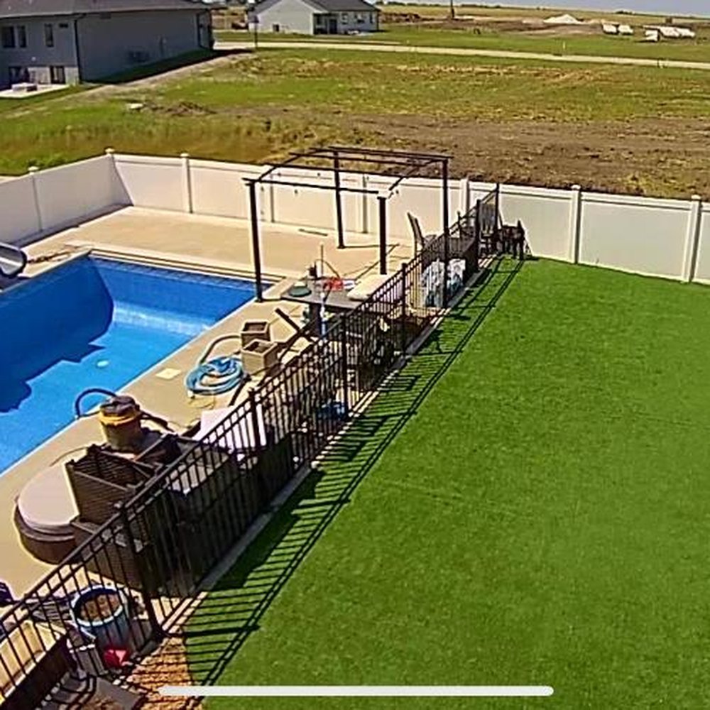 Backyard Paradise - an aerial view of a backyard pool - Landscaping Near Me