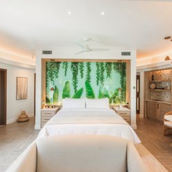 Botanical image printed on tempered glass for a resort's guest room's headboards.