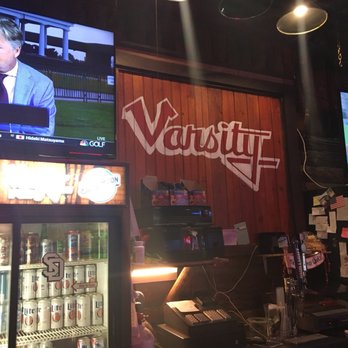 Varsity Pub - a man on television in a bar - Pubs Near Me - Vermillion, South Dakota