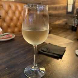 prosecco in a white wine glass. prosecco in a white wine glass.