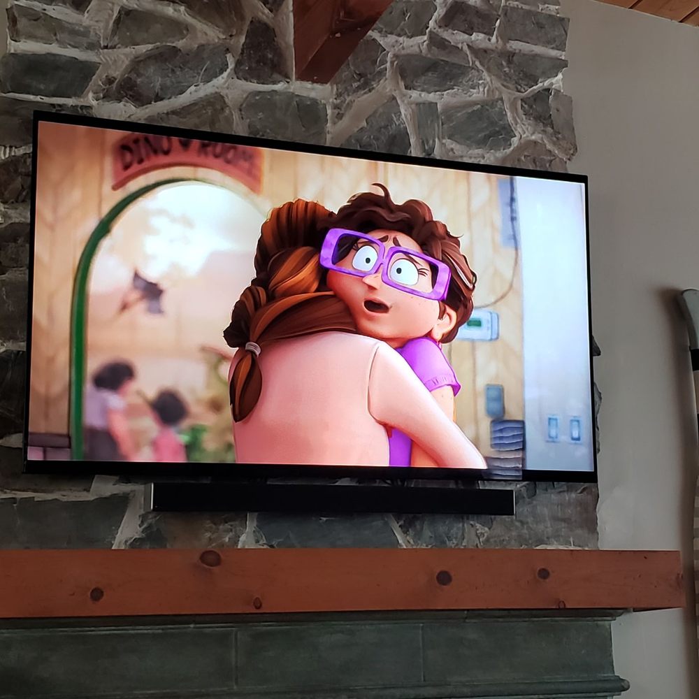 Modtech Design - Tv and soundbar mounted over fireplace... no visible wires. - Home Theatre Installation Near Me Modtech Design - Tv and soundbar mounted over fireplace... no visible wires. - Home Theatre Installation Near Me