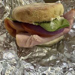 Coffee Corral - So it's English muffin, ham, egg, tomato, red onion, spinach, and chive cream cheese today I'm drinking a kombucha.