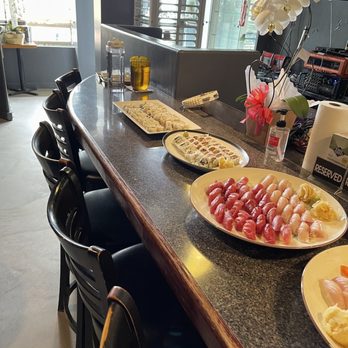 Sushi Bei - plates of sushi on a counter - Sushi Bars Near Me - Gardena, California