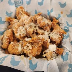 Nina's Wing Bites & Pizza - Chicken bites in white garlic parm. Crispy and full of flavor.