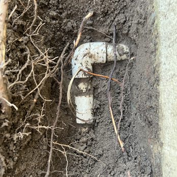 Feliz Irrigation - Photograph of the 1-inch mainline passing through a wall before repair . - Irrigation Near Me Feliz Irrigation - Photograph of the 1-inch mainline passing through a wall before repair . - Irrigation Near Me
