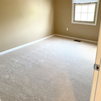 Loza's Carpet - an empty room with a window - Carpeting Near Me