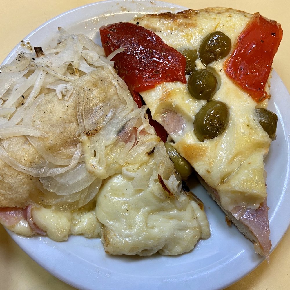 Güerrín - Fugazzetta with ham, cheese, and onions; and Especial Guerrin (Mozzarella, ham, peppers, and olives) - Pizza Near Me - Buenos Aires, C Güerrín - Fugazzetta with ham, cheese, and onions; and Especial Guerrin (Mozzarella, ham, peppers, and olives) - Pizza Near Me - Buenos Aires, C