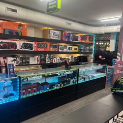 Almir Co - Interior view of ALMIR CO. with electronics accessories, gaming products, headphones, and tech items for sale.