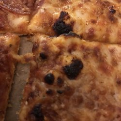 Domino's Pizza - The gently burned pizza I waited an hour and a half for. Avoid this restaurant.