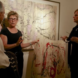 Bryant Street Gallery - Tracey Adams talking about her unframed folded work to artists Howard Hersh and Lorraine Lawson photo credit: Marie Cameron