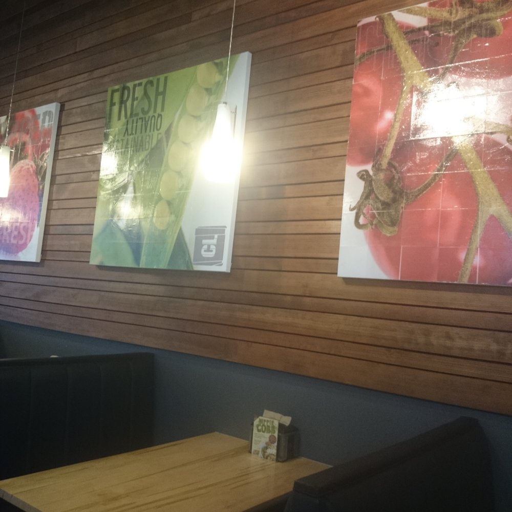 a wooden wall with posters on it a wooden wall with posters on it