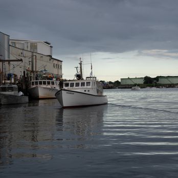 Casco Bay Custom Charters - Even on cloudy days, Portland Maine is beautiful. Moody photo of our boats in the Portland Harbor. - Boat Charters Near Me - Portland, Maine