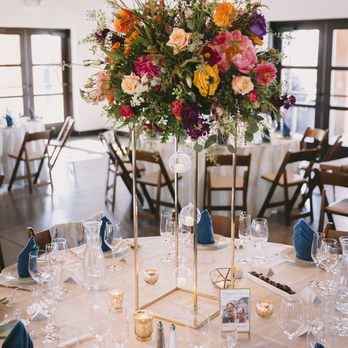 Petal Town Flowers - Tall show-stopper centerpieces for the round tables - Florists Near Me