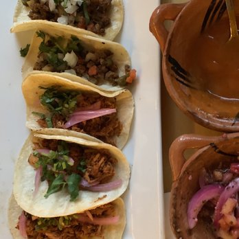 Don Nopal - a plate of tacos and a bowl of sauce - Mexican Near Me - Montreal, Quebec Don Nopal - a plate of tacos and a bowl of sauce - Mexican Near Me - Montreal, Quebec