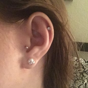Platinum Ink - See my review below, here is my tragus nearly a month later. Placement is awful and the piercing has migrated slightly. - Tattoo Near Me - Austin, Texas
