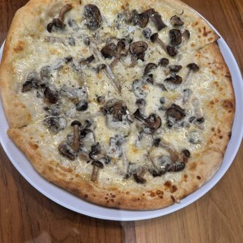 Union On Yale - Forest floor pizza- trio of mushrooms: hen of the woods, Cremini and Beech. Mozzarella fontina and black truffle cheese. It's large! - New American Near Me - Claremont, California Union On Yale - Forest floor pizza- trio of mushrooms: hen of the woods, Cremini and Beech. Mozzarella fontina and black truffle cheese. It's large! - New American Near Me - Claremont, California