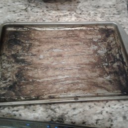 One of the dirty baking sheets we pulled out One of the dirty baking sheets we pulled out