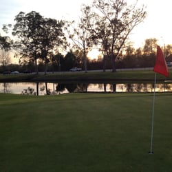 Bixby Village Golf Center - Green on hole 2 looking at the hazard pond on the west side of the green