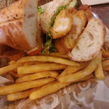 Fish District - Shrimp Po' Boy and battered fries. - Seafood Near Me - Carlsbad, California Fish District - Shrimp Po' Boy and battered fries. - Seafood Near Me - Carlsbad, California