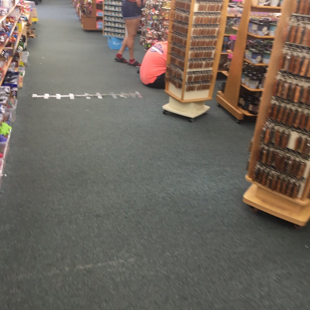 Bargain Beachwear - Sitting while customers are walking by.. - Discount Store Near Me - Myrtle Beach, South Carolina Bargain Beachwear - Sitting while customers are walking by.. - Discount Store Near Me - Myrtle Beach, South Carolina
