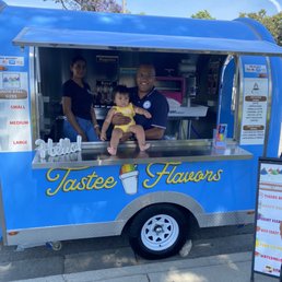a man and a baby in a food truck a man and a baby in a food truck