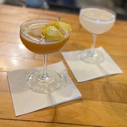 Daiquiri Time Out - Daiquiri Time Out Happy Hour: Bees Knees on the left with honeycomb and lemon peel, and a Hemingway Daiquiri on the right. Great drinks!