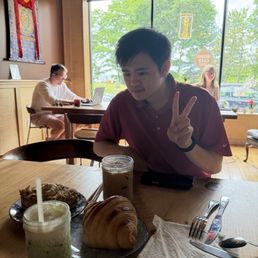 iced Matcha and iced vanilla latte with banana cream donut and croissant iced Matcha and iced vanilla latte with banana cream donut and croissant