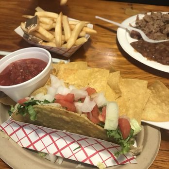 The Pedalin' Pig BBQ - Single taco, with plain chopped chicken on bottom of shell. - Barbeque Near Me - Blowing Rock, North Carolina The Pedalin' Pig BBQ - Single taco, with plain chopped chicken on bottom of shell. - Barbeque Near Me - Blowing Rock, North Carolina