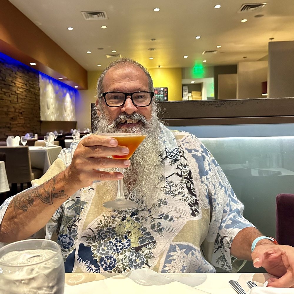 Assaggio Bistro - Happy customer with a martini - Italian Near Me - Honolulu, Hawaii