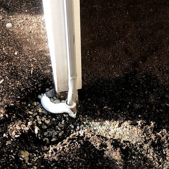ProCleaning Seattle - Clogged downspout was causing complete overflow during rains, washing the mulch and dirt away from the house. - Pressure Washers Near Me