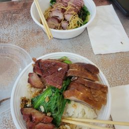 Roast pork and duck over rice (front) and roast pork over noodles (behind) Roast pork and duck over rice (front) and roast pork over noodles (behind)