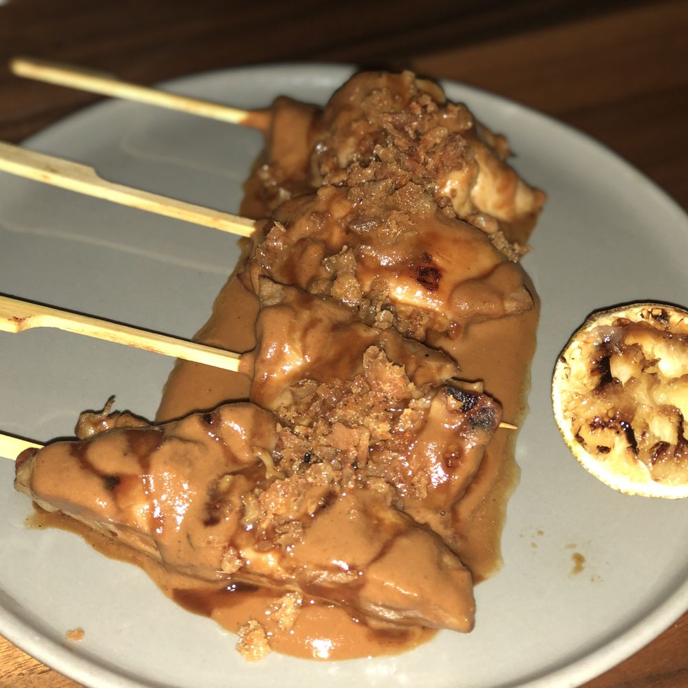 Lulu Bar - meat skewers with sauce on a white plate - Desserts Near Me - Calgary, Alberta Lulu Bar - meat skewers with sauce on a white plate - Desserts Near Me - Calgary, Alberta