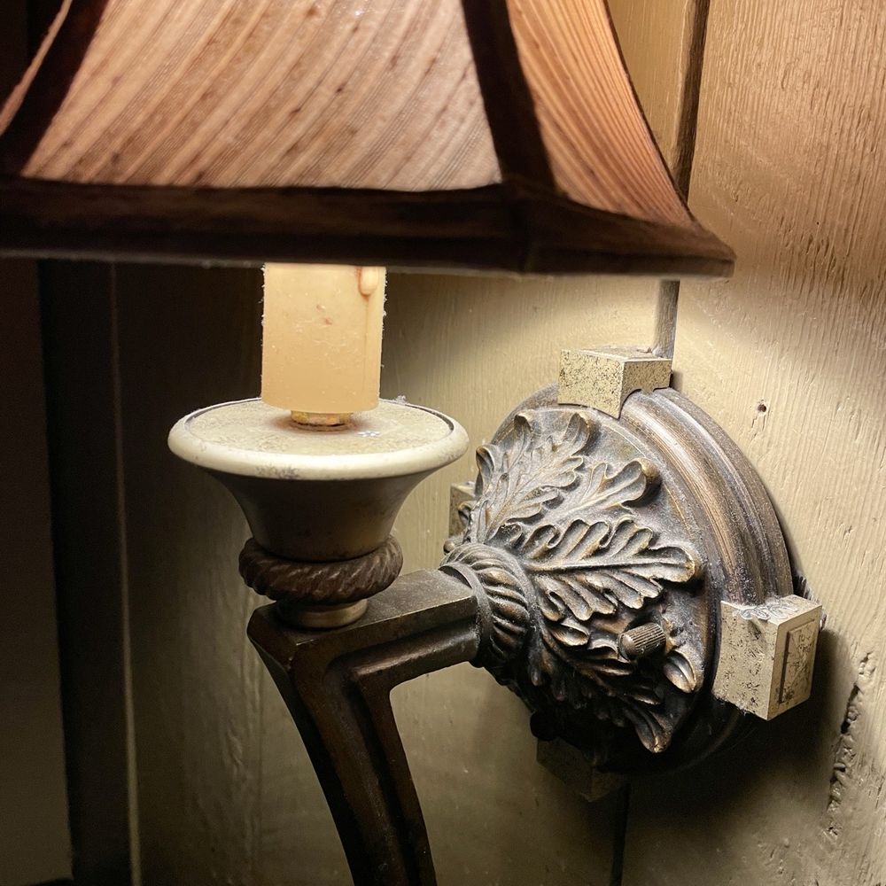 Antiquity Restaurant - Sconce over our table could use a good dusting; turn off when it's so close to your food/face - Seafood Near Me - Albuquerque, New Mexico