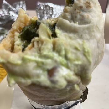 Taqueria Los Pericos - The guacamole and sour cream inside spills out of the super burrito - Mexican Near Me - Dublin, California Taqueria Los Pericos - The guacamole and sour cream inside spills out of the super burrito - Mexican Near Me - Dublin, California