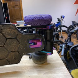 Rent EBoards Houston - Jake working on my Ownboard zeus pro, he installed 7in evolve tires on my board.