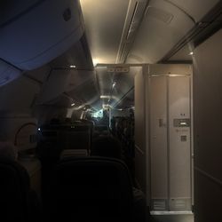 United Airlines - Way in da back 42C - Aisle Seat, Close to the bathroom!