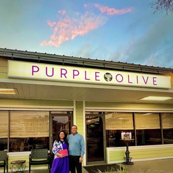Purple Olive - a couple standing outside - Wine Bars Near Me - Saint Augustine, Florida