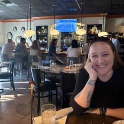 Eclipse Bistro - Bar area which has a fabulous happy hour. And a very happy guest.