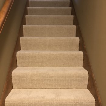 Flooring Correct - a person walking up a set of stairs - Flooring Near Me - Wentzville, Missouri Flooring Correct - a person walking up a set of stairs - Flooring Near Me - Wentzville, Missouri
