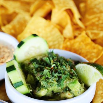 Social Cantina - a bowl of guacamole and chips - Tacos Near Me - Indianapolis, Indiana Social Cantina - a bowl of guacamole and chips - Tacos Near Me - Indianapolis, Indiana