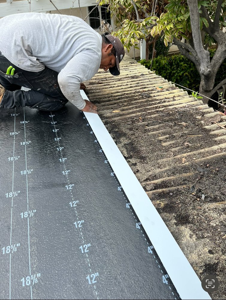 Slide of TopStamp Roofing
