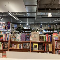 Kinokuniya - Stuffed Totoros chilling on the shelves. Books. Posters.